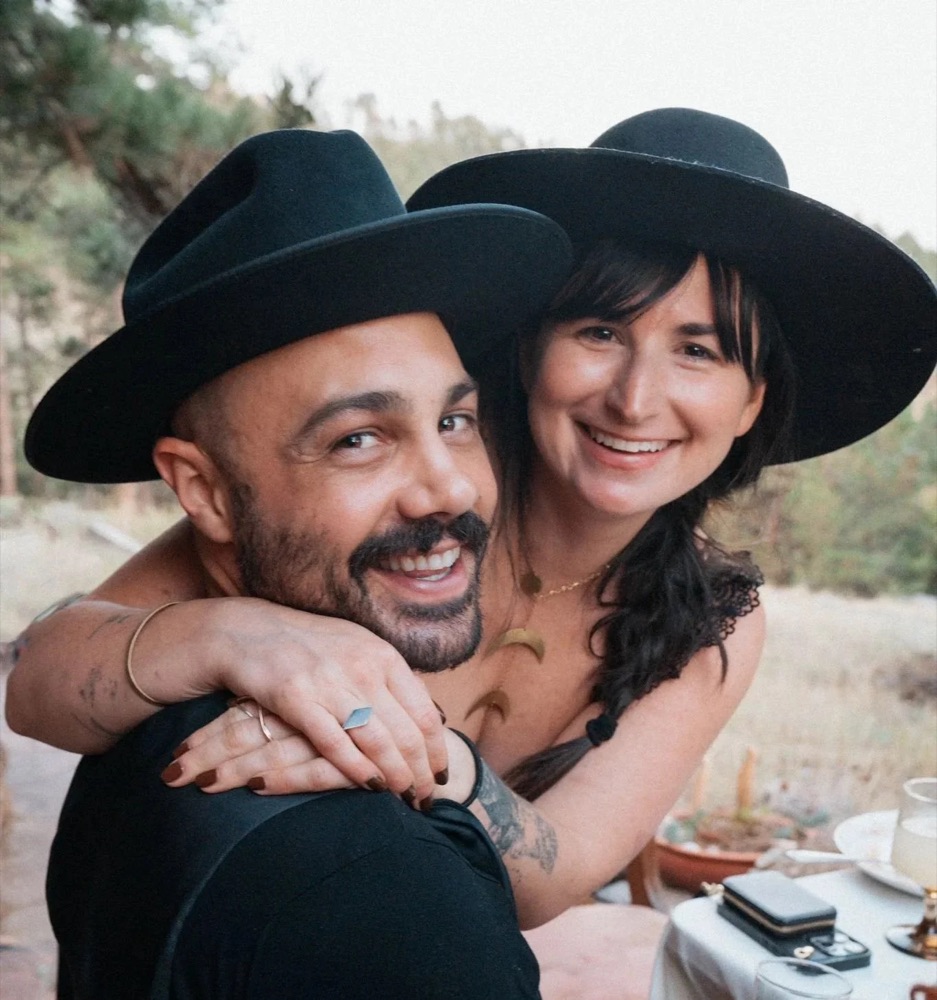 Jade Levinson laughing with her partner outdoors