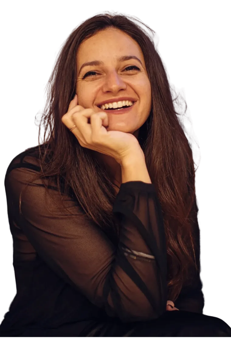Zahava Rose, smiling, resting her chin on her hand